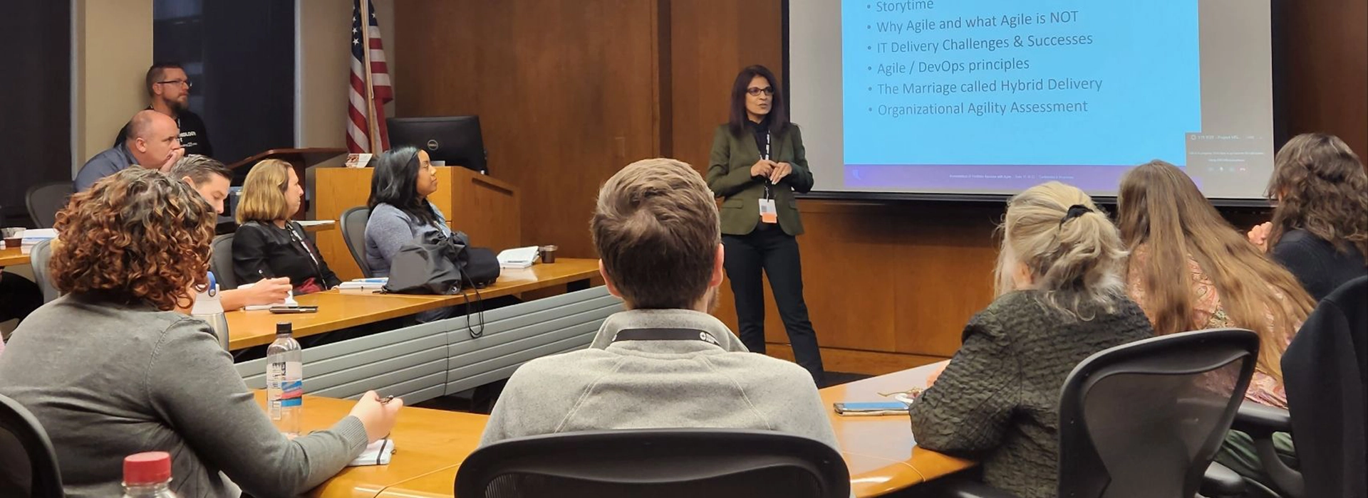 A photo of Ashima Sharma, founder of Ayuka Consulting, teaching a group of professionals about Digital Transformation.