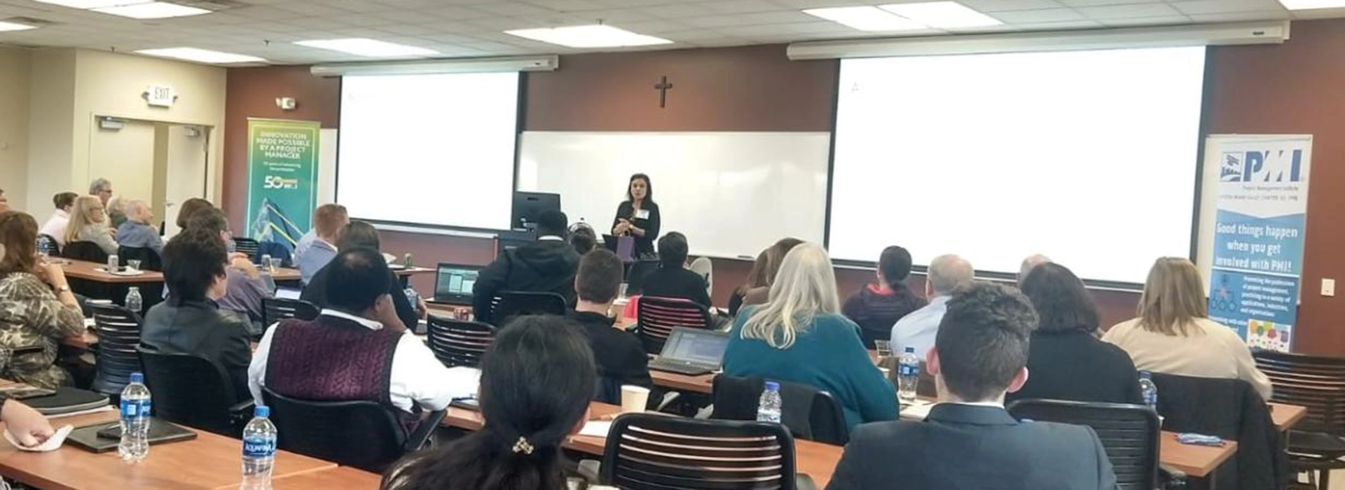 A photo of Ashima Sharma, founder of Ayuka Consulting, teaching a group of professionals about Digital Transformation.