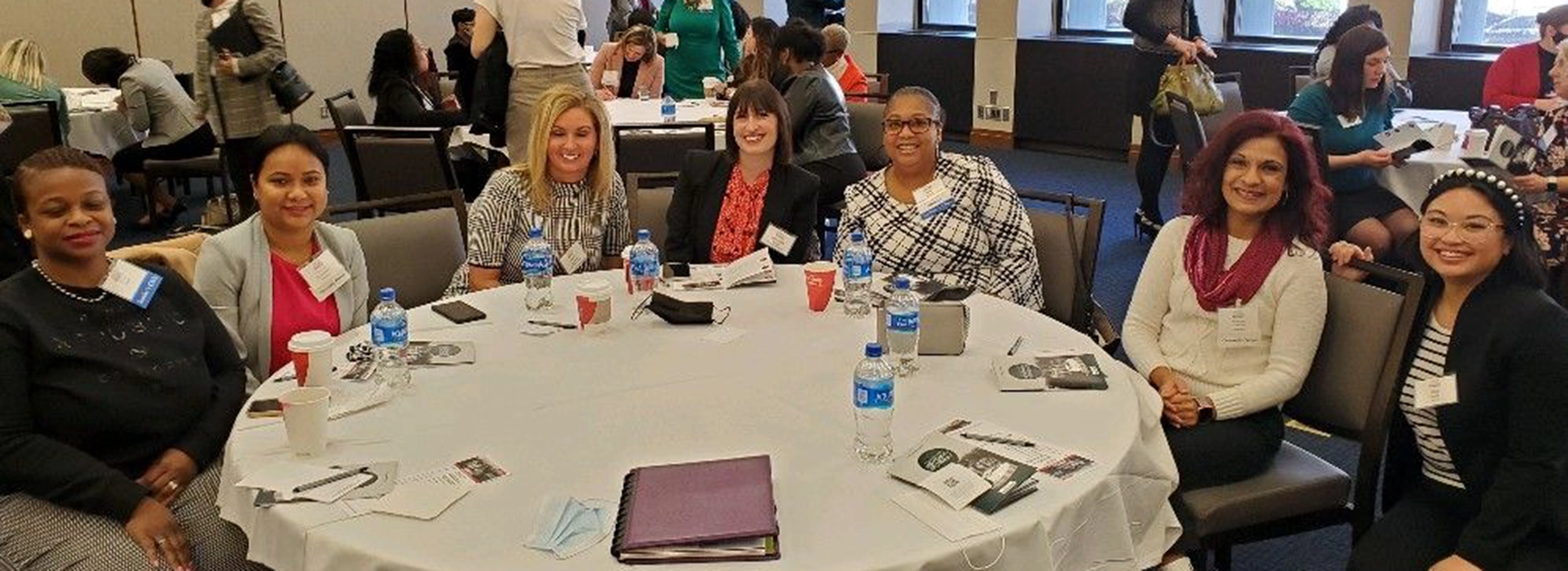 A photo of women sitting around a table during a Digital Transformation event.